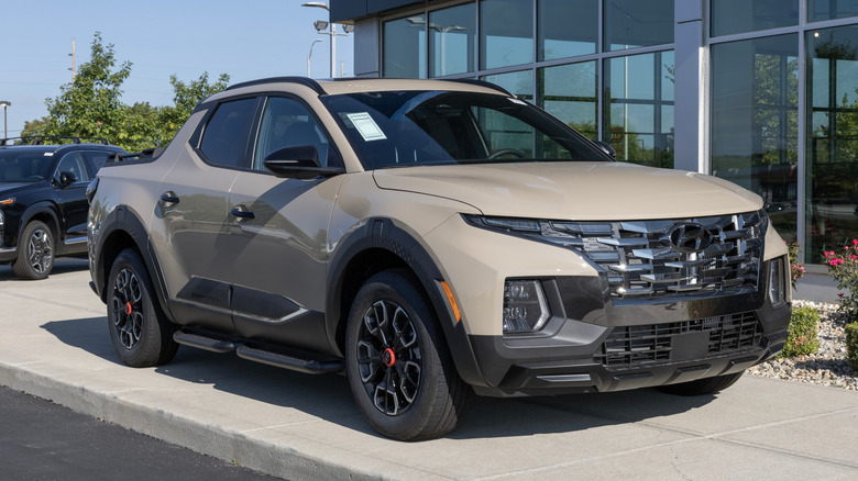 Hyundai dealership with a Santa Cruz out front