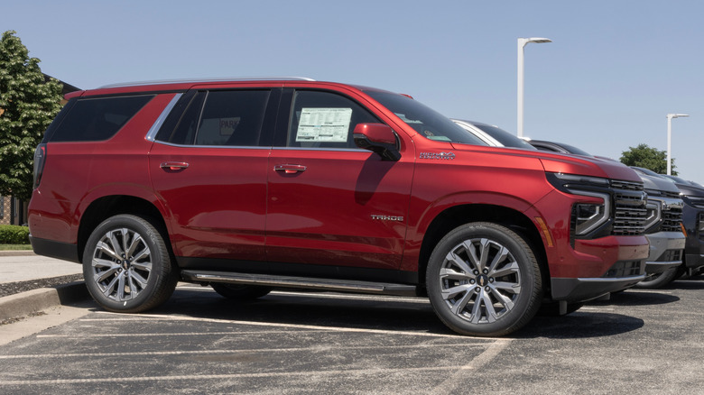 A red 2026 Chevrolet Tahoe in a dealership lot