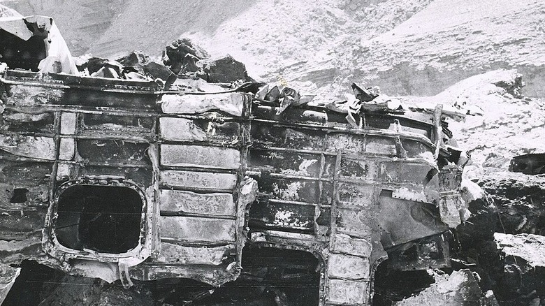A burned forward fuselage fragment photographed at the TWA impact site.