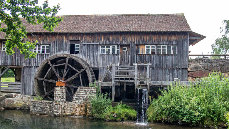 A water wheel powering a saw mill.