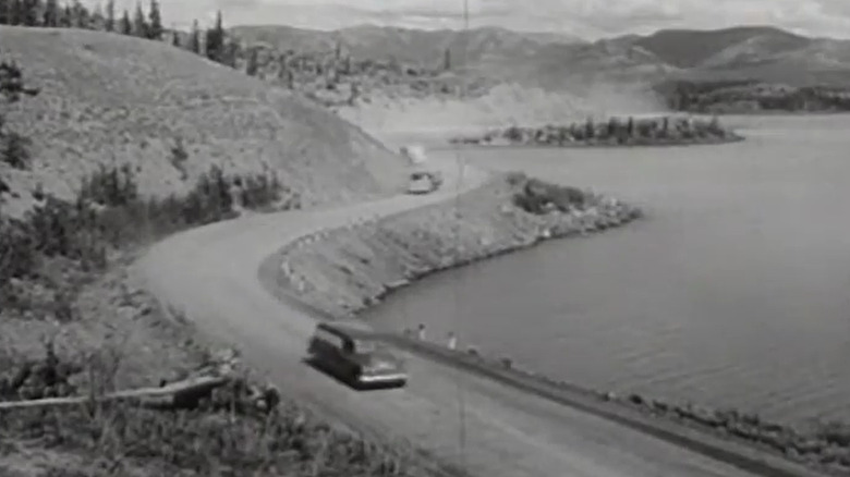 A Chevrolet Suburban driving on the Alcan Highway in 1957
