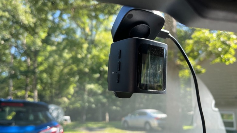 Baseus dashcam installed on windshield of car