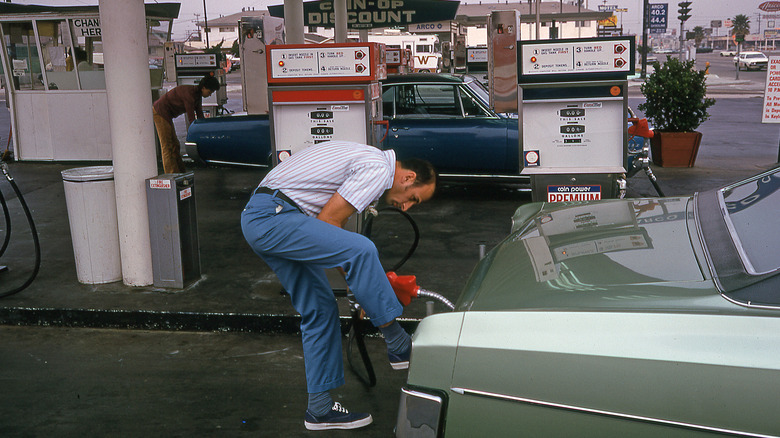A man pumps gas