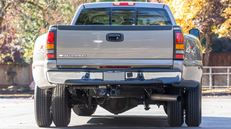 the rear end of a gray Chevrolet Silverado dually