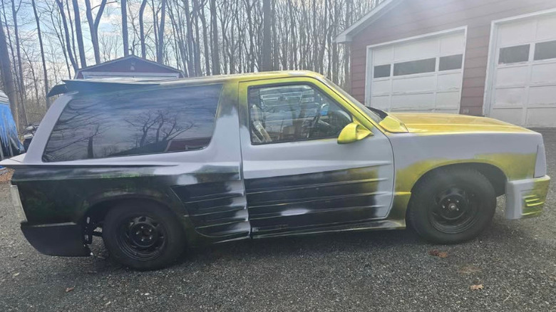 A green and black Chevy Blazer with Testerossa body cladding