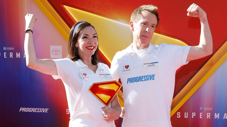 Progressive Insurance characters Flo and Jamie pose at a movie premier