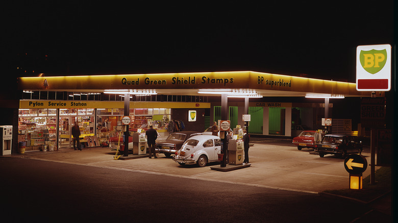 Classic cars at a gas station