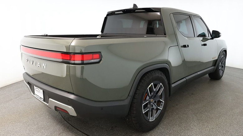 Rear 3/4 view of a green Rivian R1T
