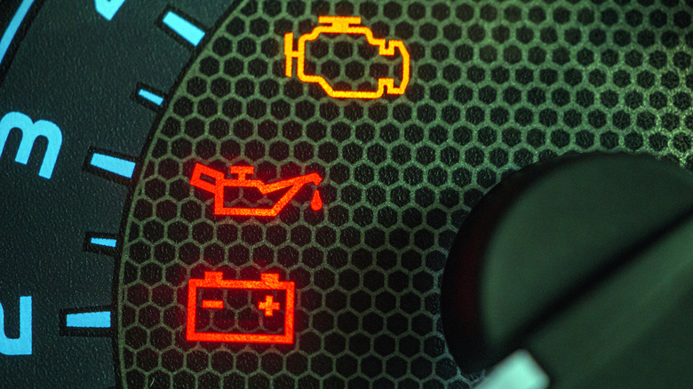 A dash close-up showing warning lights