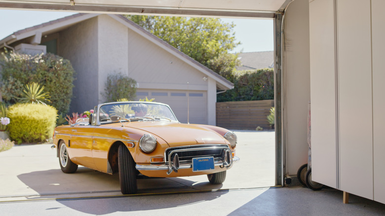 MGB Roadster pulling into a garage