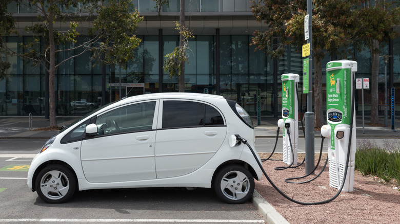 Side-shot of a Mitsubishi i-MiEV at a charging station