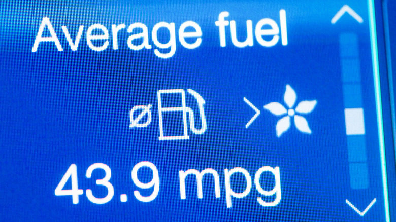 A digital display featuring average fuel consumption of a car