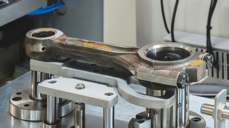 A I-beam piston rod undergoing inspection.