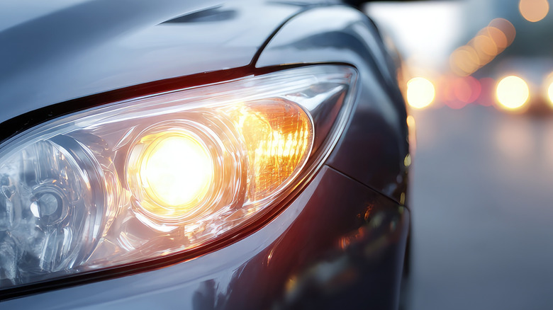 A hybrid headlight, featuring separate reflector and projector units
