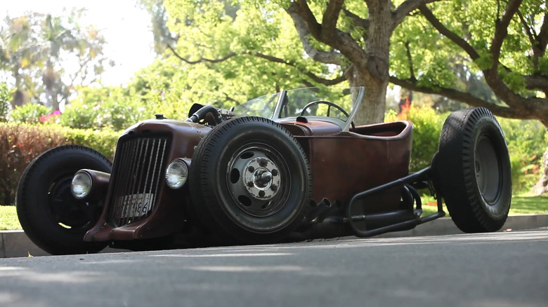 A 1931 Ford-based rat rod parked on a road