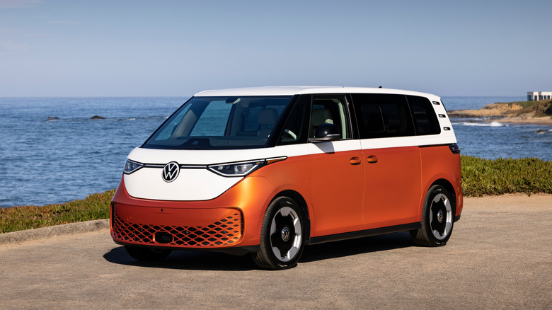 Front 3/4 view of an orange and white Volkswagen ID Buzz
