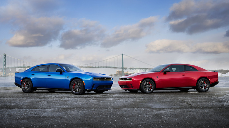 Front 3/4 view of blue and red Dodge Charger Daytona EVs