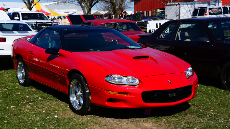 Bright red 2000 Chevrolet Camaro SS three-quarter view on sunny day