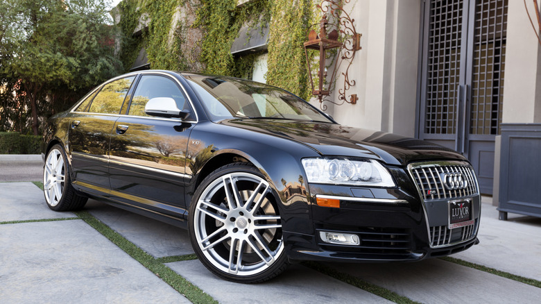 A photo of a parked black 2009 Audi S8, the S8 is the largest sedan from Audi and features a V10 engine.