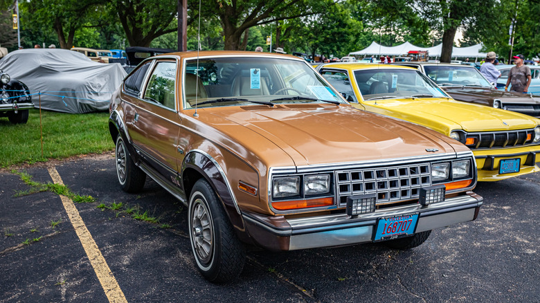 High perspective front corner view of a 1982 AMC Eagle SX/4 Sport Coupe at a local car show.
