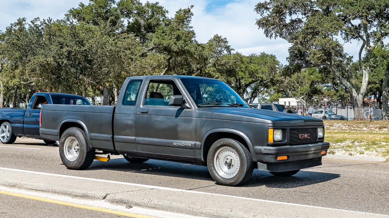 Wide angle front corner view of a 1993 GMC Sonoma Extended Cab at a local car show.