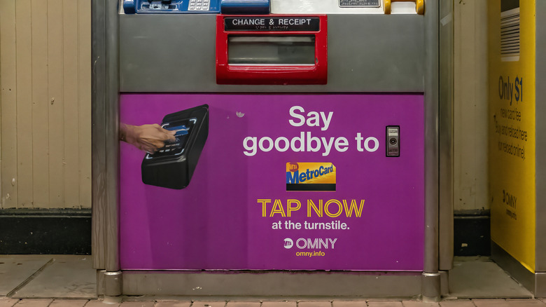 New York City, NY, USA – May 17, 2025 - Inside a NYC subway station, a MetroCard vending machine advertises the OMNY system, marking the transition away from MetroCards.