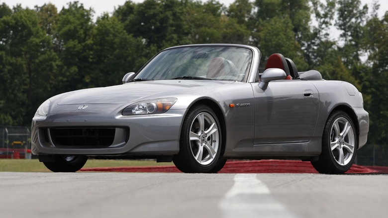 A front 3/4 view of a silver 2009 Honda S2000.