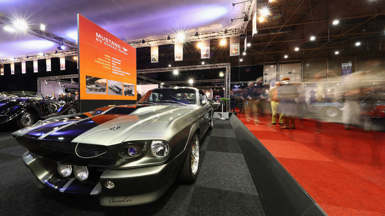 An Eleanor Mustang parked at an indoor car show