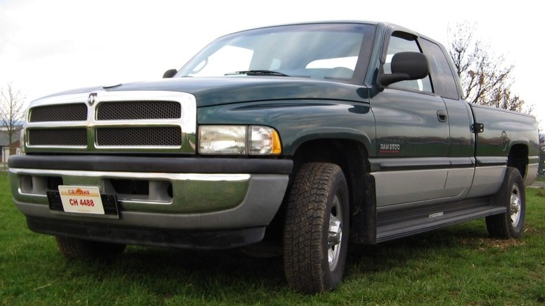 A dark second-generation medium-duty Dodge Ram 2500 parked on grass.