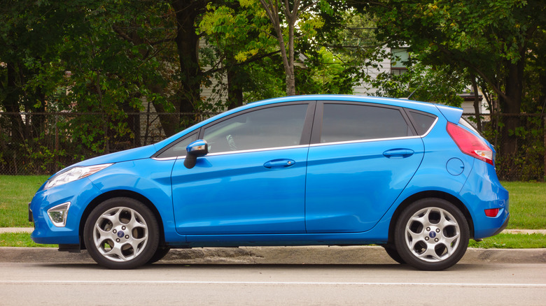 A blue Ford Fiesta parked at a curb