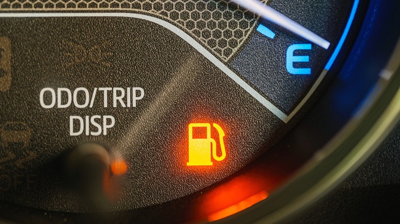 Low fuel levels trigger the low fuel warning light on the instrument panel.