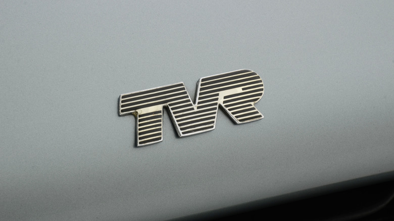 Close-up of a TVR logo on a car