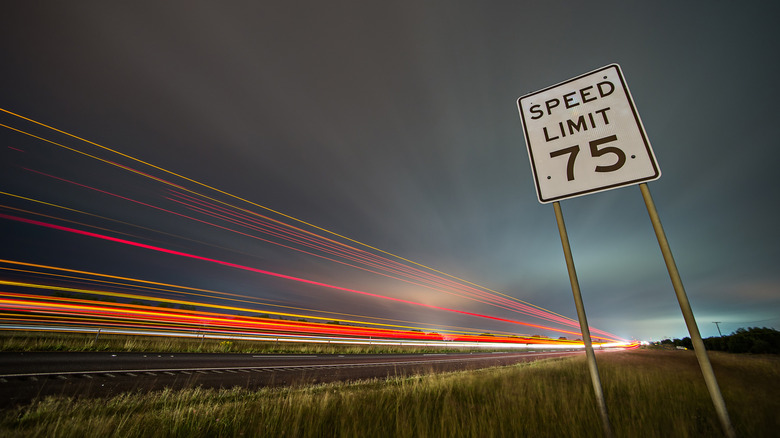 Speed limit sign on the side of a freeway