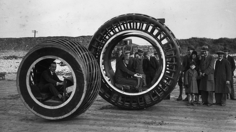 John Archibald Purves, inventor of the Dynasphere showing his invention to a crowd of onlookers