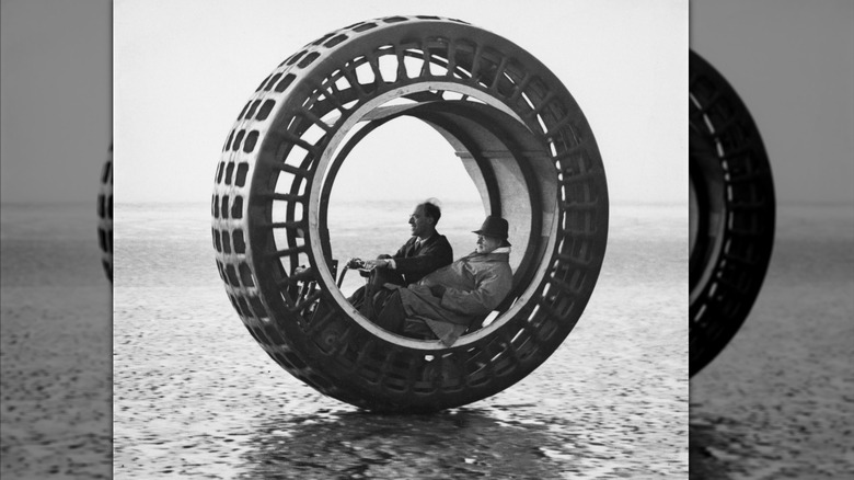 John Archibald Purves taking a passenger for a ride in the Dynasphere