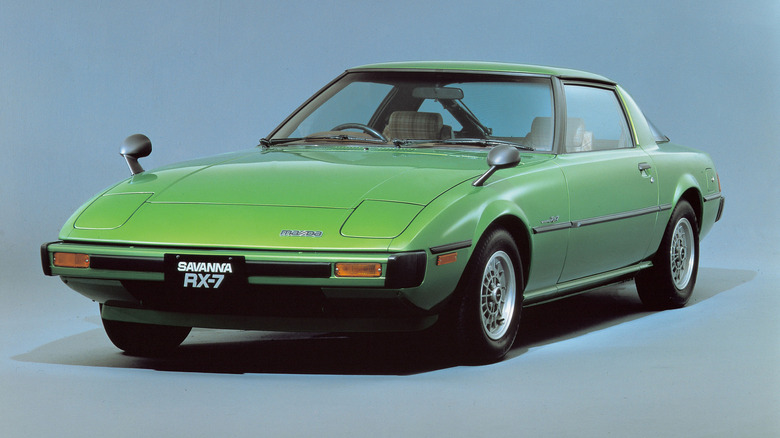 A green first-generation Mazda RX-7.