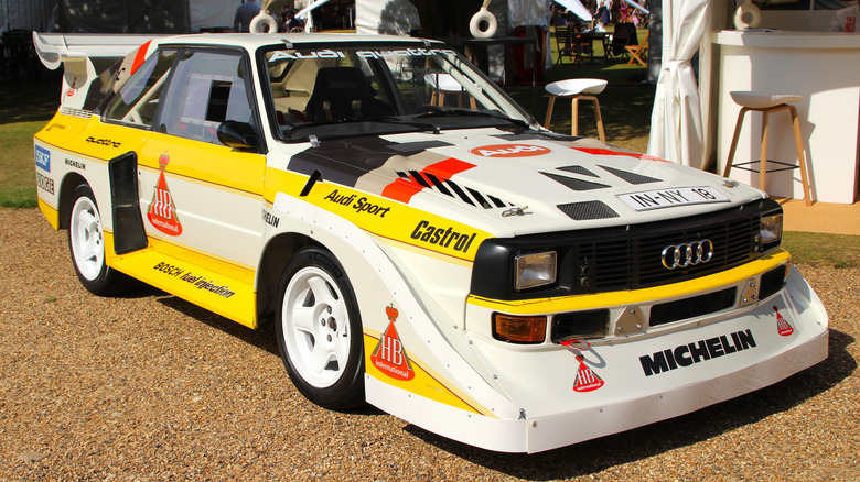 The interior of the Porsche 962, showing its shift buttons on the steering wheel to control the PDK dual-clutch transmission