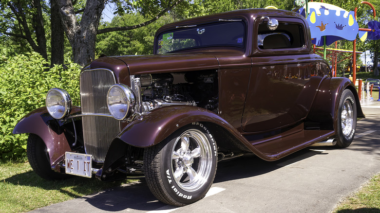 A thoroughly modified Ford Deuce Coupe hot rod in the sunshine.