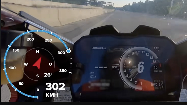 The speedometer of a Ducati Panigale V4 with an overlay of a GPS speedometer, with the Ducati showing three dashes where the speed would usually be.
