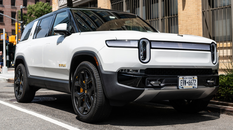 A white Rivian R1S parked in New York