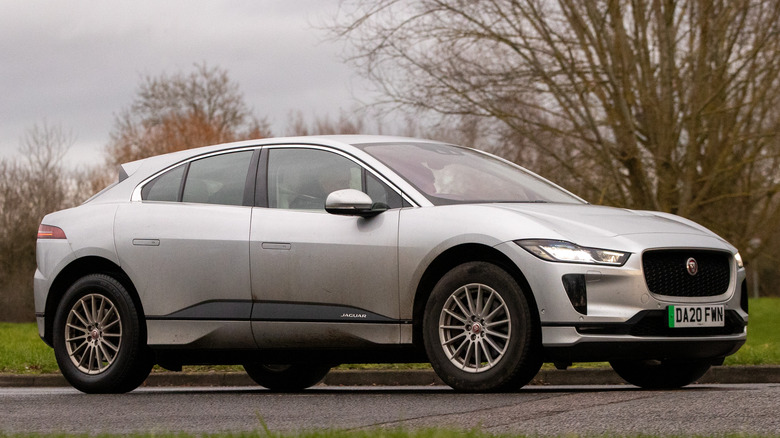 A silver Jaguar I-Pace driven on the road.