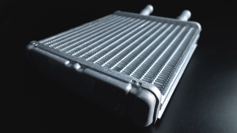 Close up of car radiator on black background