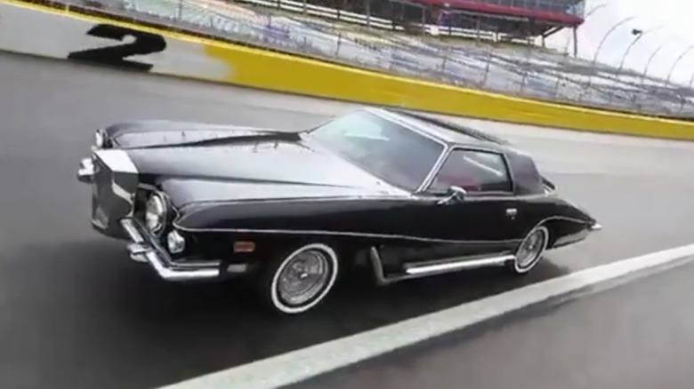 Dale Earnhardt Jr. takes Elvis Presley's Stutz Blackhawk for a spin at the Charlotte Motor Speedway