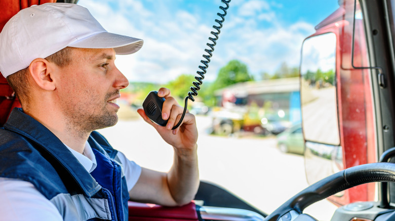 A truck driver using a CB radio