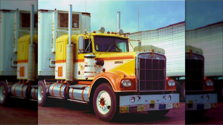 A long-nose Monfort Circus Wagon parked outside