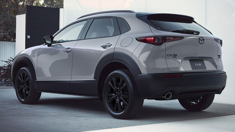Rear 3/4 view of a gray Mazda CX-30