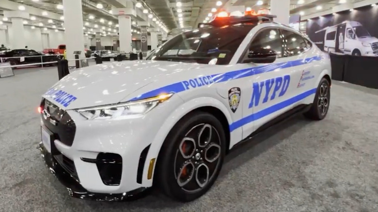 Front 3/4 of NYPD Ford Mustang Mach-E police car on display at 2022 NY Auto Show.
