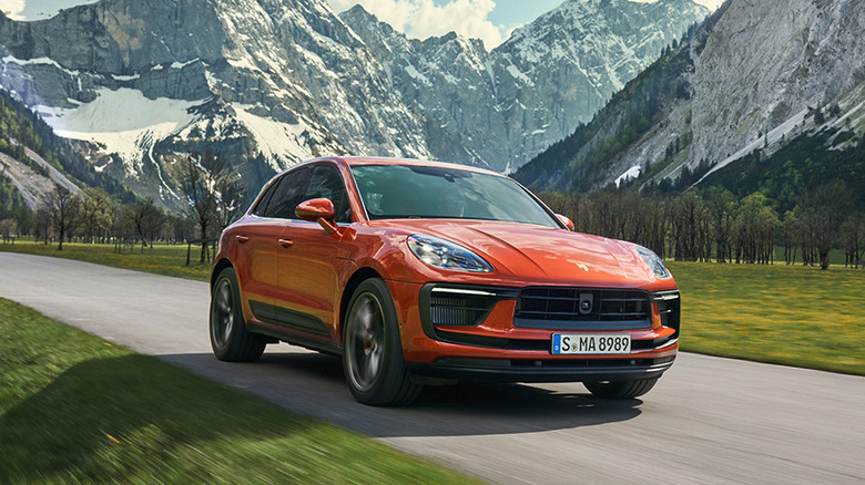 Porsche Macan driving along a mountain road