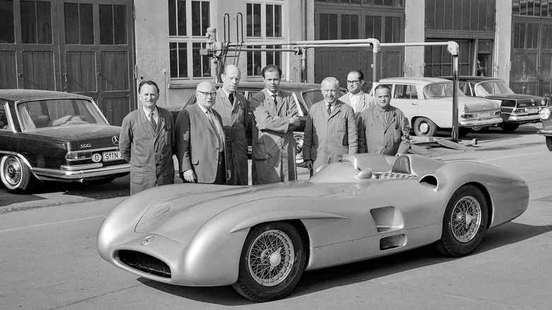 Mercedes employees standing next to W 196 R