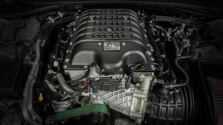 A close up of the HEMI V8 Demon engine block in a car's engine bay.